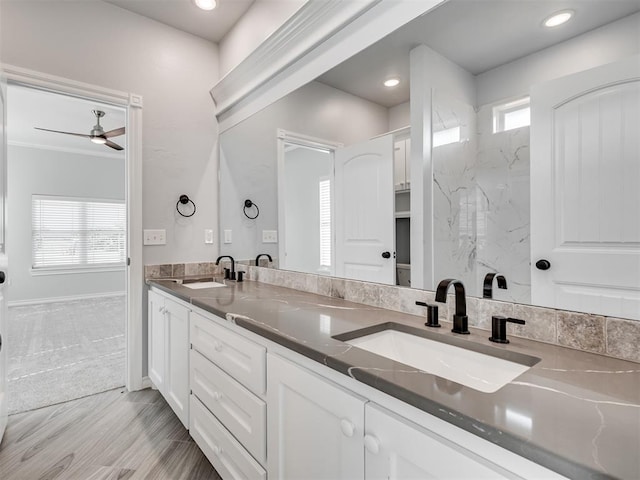 bathroom featuring vanity, plenty of natural light, and ceiling fan