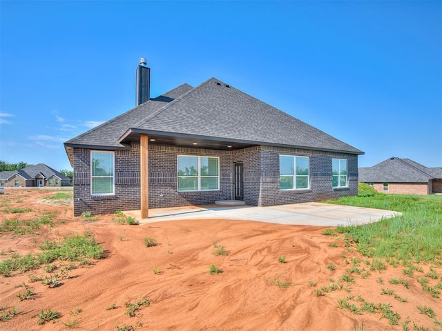 rear view of house with a patio area