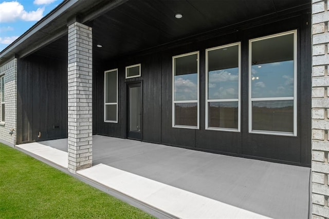 view of side of property with a patio area