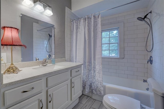 full bathroom with vanity, shower / bath combination with curtain, and toilet