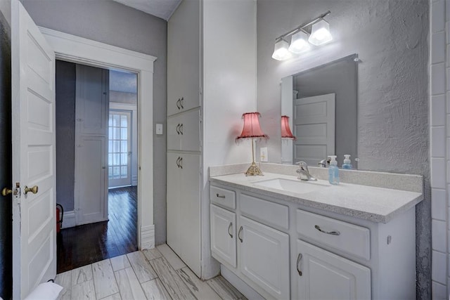 bathroom with vanity and wood-type flooring