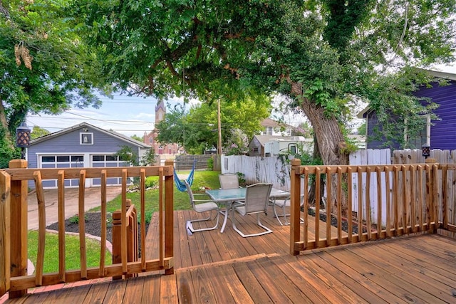 wooden deck featuring a yard