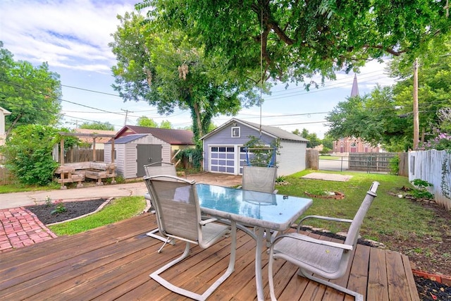 wooden deck featuring a yard and a shed