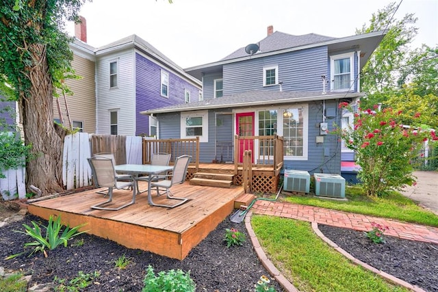 rear view of property featuring a deck