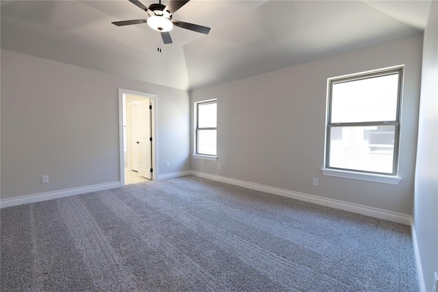 unfurnished room featuring carpet floors, vaulted ceiling, and ceiling fan