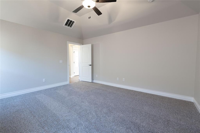 carpeted spare room with vaulted ceiling and ceiling fan