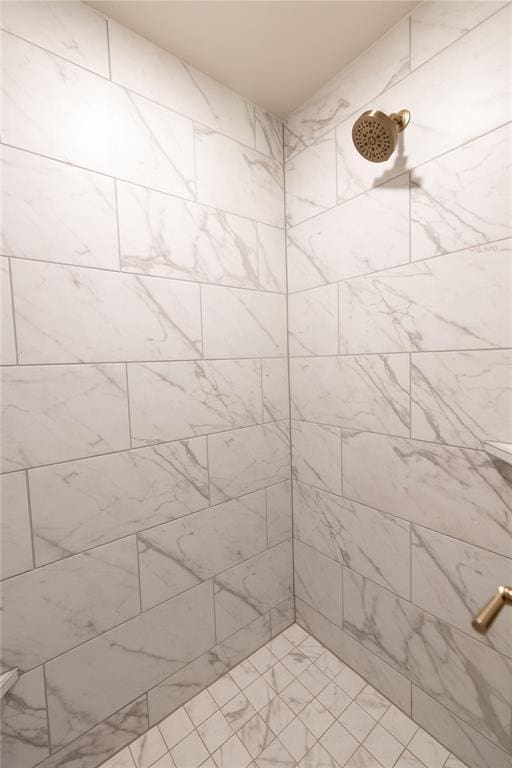 bathroom with tiled shower