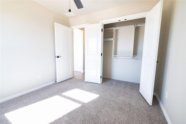 unfurnished bedroom featuring a closet, ceiling fan, and carpet flooring