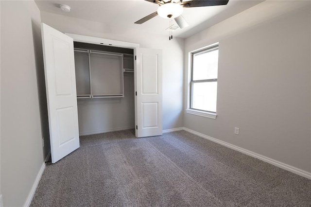 unfurnished bedroom featuring a closet, ceiling fan, and carpet