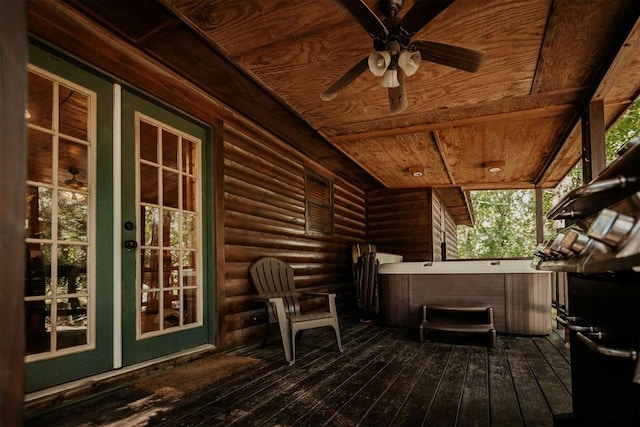 deck with ceiling fan, french doors, and a hot tub