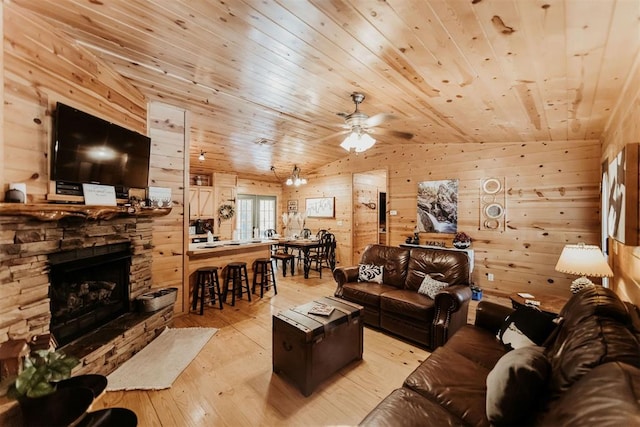 living room with wooden ceiling, light hardwood / wood-style floors, lofted ceiling, and wood walls