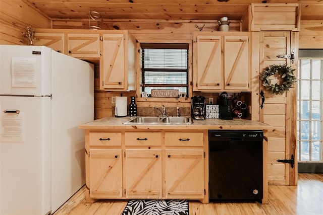 kitchen with dishwasher, white refrigerator, sink, and a wealth of natural light