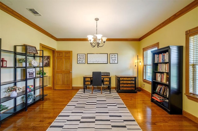 office space with a chandelier, wood-type flooring, and ornamental molding