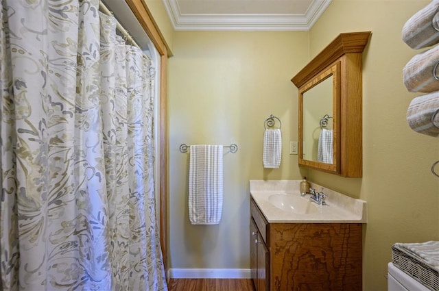 bathroom featuring vanity, hardwood / wood-style flooring, curtained shower, and crown molding