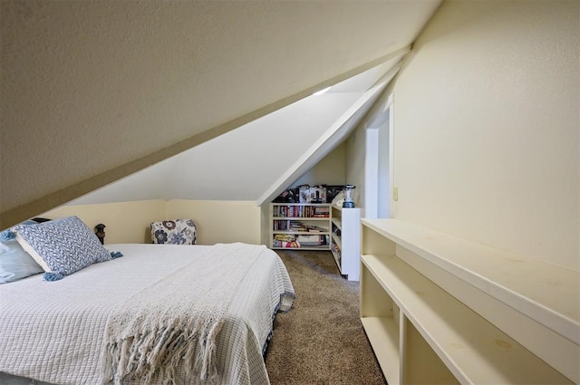 carpeted bedroom with lofted ceiling