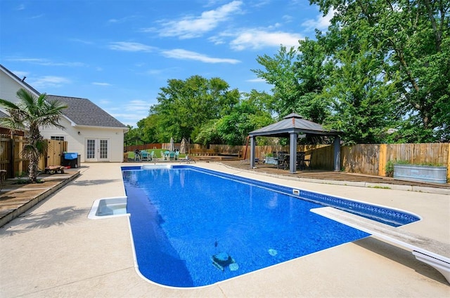 view of pool featuring a gazebo, a diving board, french doors, and a patio