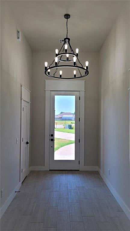 entryway featuring a chandelier