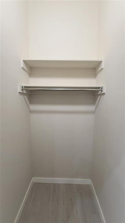 1425 W Harvard Way, Mustang, OK 73064 - spacious closet with wood finished floors
