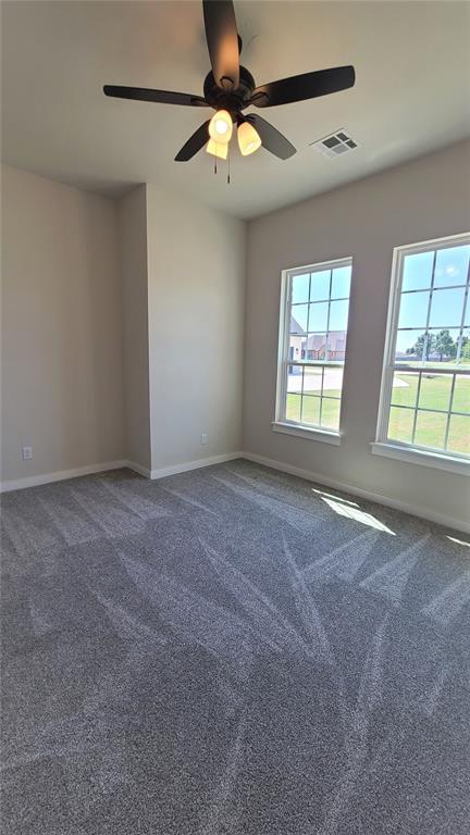 1425 W Harvard Way, Mustang, OK 73064 - empty room featuring baseboards, carpet, and ceiling fan