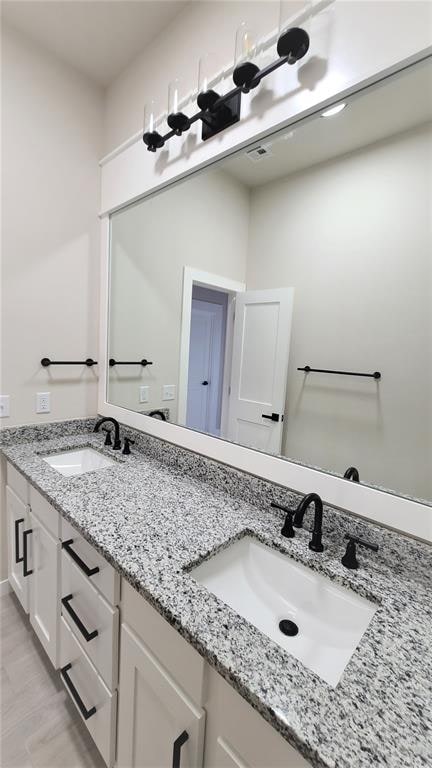 bathroom featuring vanity and hardwood / wood-style flooring