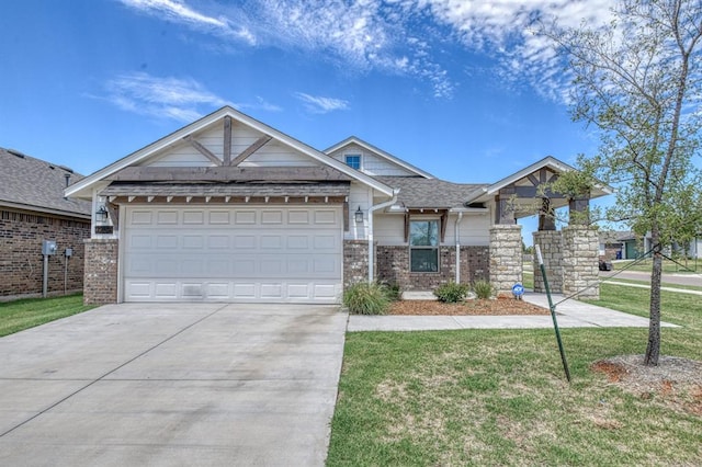 view of front of home with a front yard and a garage