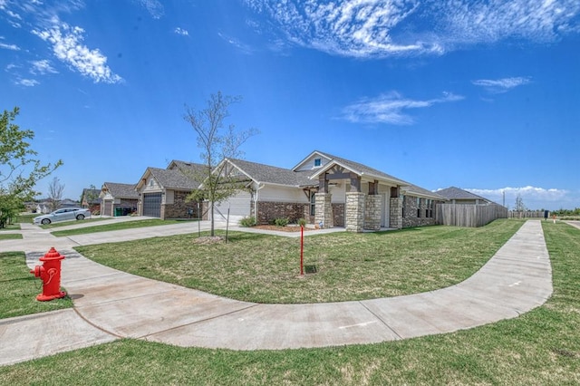 view of front of house with a front lawn and a garage