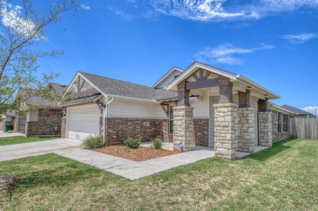 view of front of house with a front yard and a garage