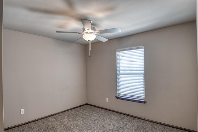 carpeted empty room with ceiling fan