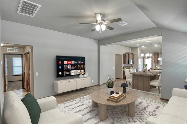 living room with vaulted ceiling and ceiling fan