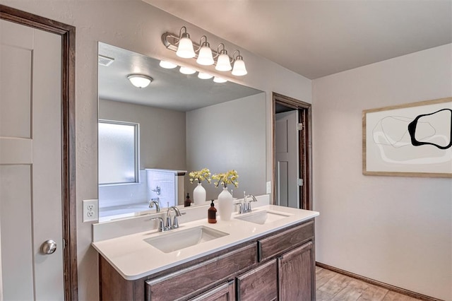 bathroom featuring a bath and vanity