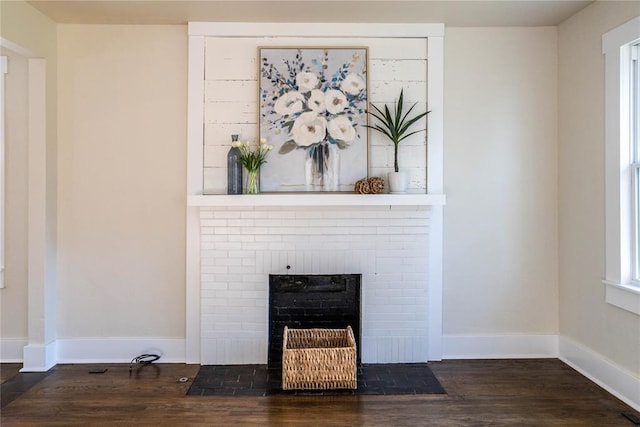 room details with hardwood / wood-style floors and a fireplace