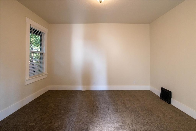 unfurnished room featuring carpet