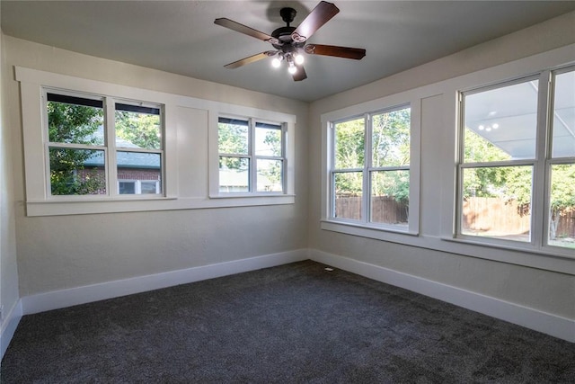 512 N College St, Cordell, OK 73632 - empty room featuring baseboards, dark colored carpet, and ceiling fan