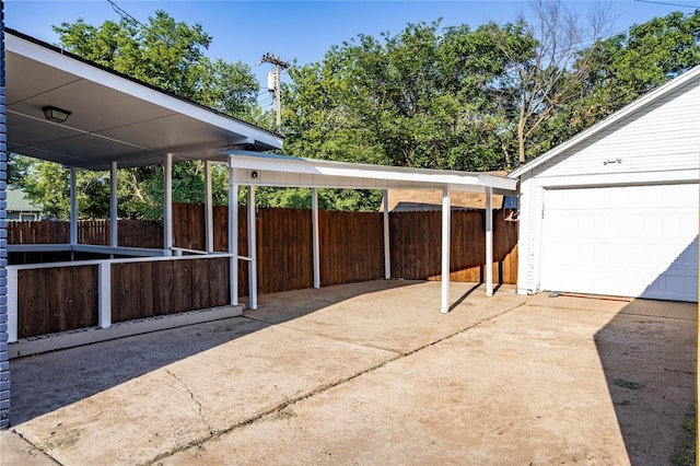512 N College St, Cordell, OK 73632 - view of patio / terrace with concrete driveway and a garage
