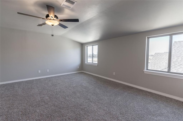 unfurnished room with ceiling fan, carpet floors, and vaulted ceiling