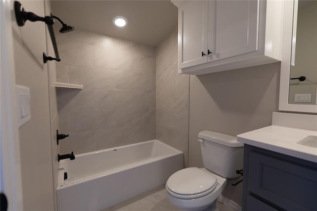 full bathroom featuring toilet, vanity, and tiled shower / bath combo