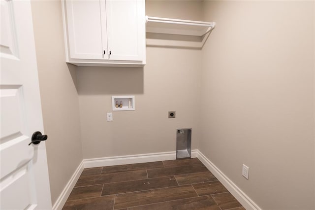 washroom featuring cabinets, hookup for a washing machine, and electric dryer hookup