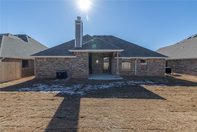 back of property with a patio area and cooling unit