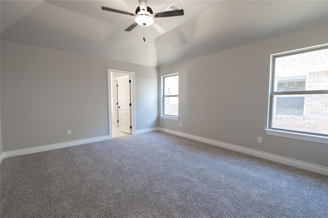 unfurnished room featuring vaulted ceiling, ceiling fan, and carpet flooring