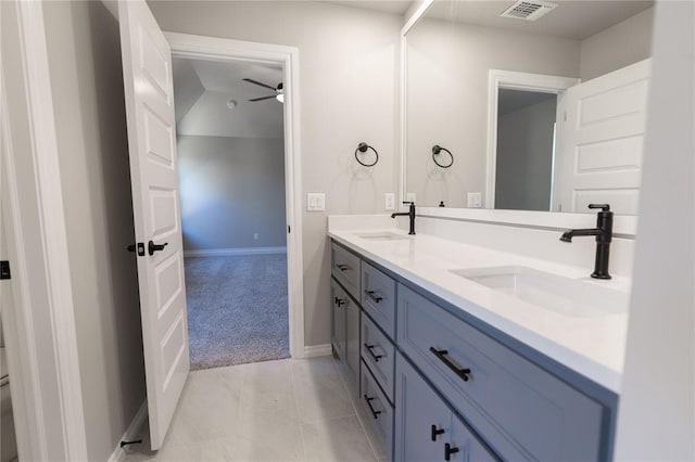 bathroom with ceiling fan, vanity, and tile patterned floors