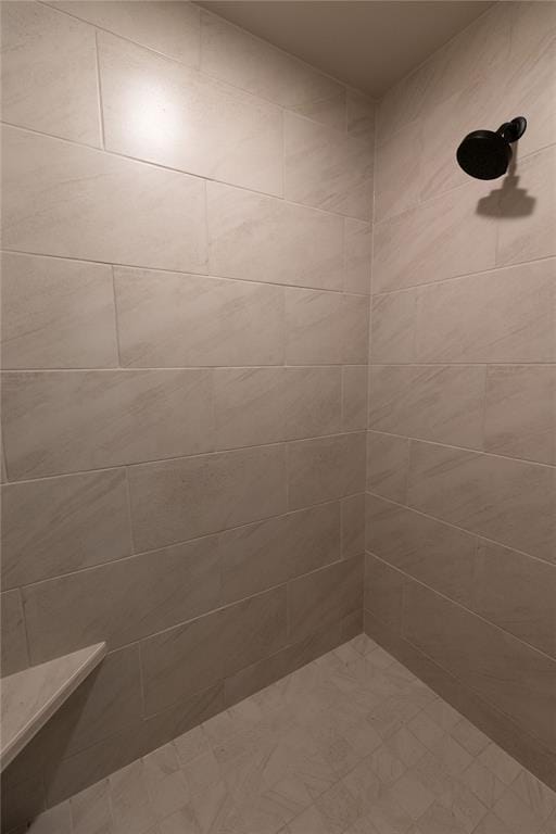 bathroom with tiled shower