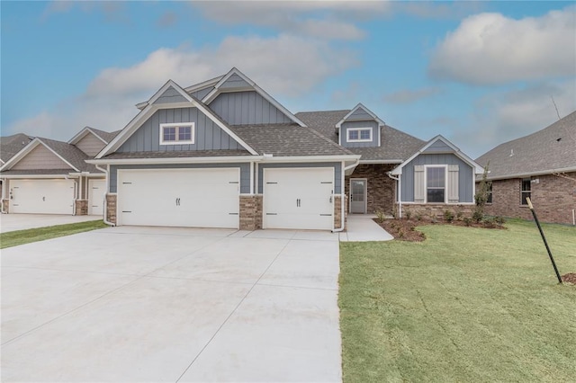 1733 Taines Turn, Norman, OK 73072 - craftsman house featuring board and batten siding, a shingled roof, a front lawn, concrete driveway, and a garage
