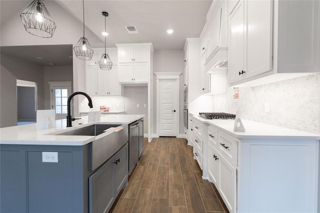 1733 Taines Turn, Norman, OK 73072 - kitchen with visible vents, light countertops, dark wood-style flooring, and white cabinetry