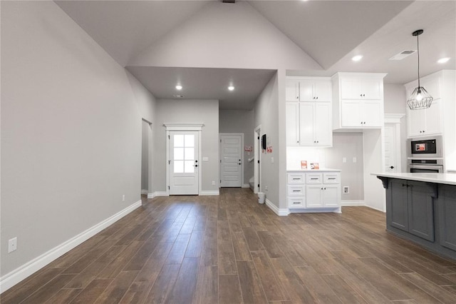 1733 Taines Turn, Norman, OK 73072 - kitchen featuring built in microwave, light countertops, oven, and dark wood-type flooring