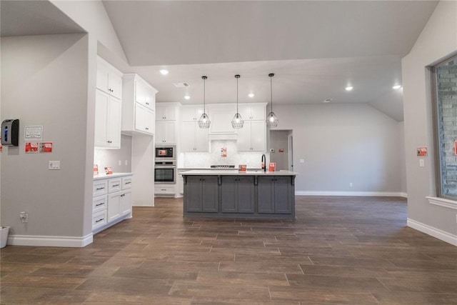 1733 Taines Turn, Norman, OK 73072 - kitchen featuring white cabinets, light countertops, and lofted ceiling