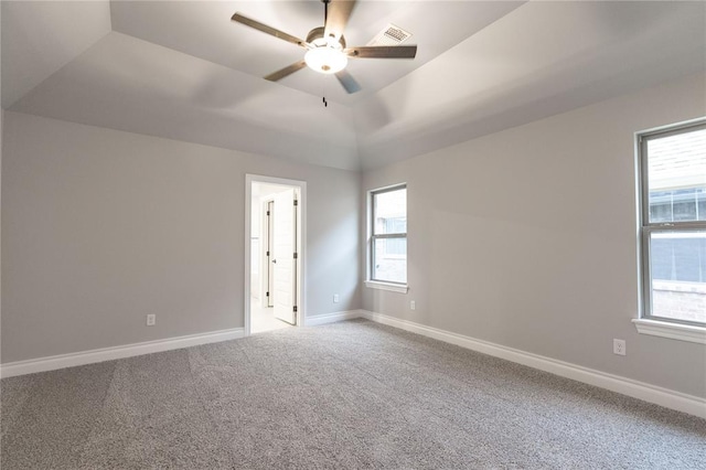 1733 Taines Turn, Norman, OK 73072 - spare room with visible vents, baseboards, vaulted ceiling, carpet floors, and a ceiling fan