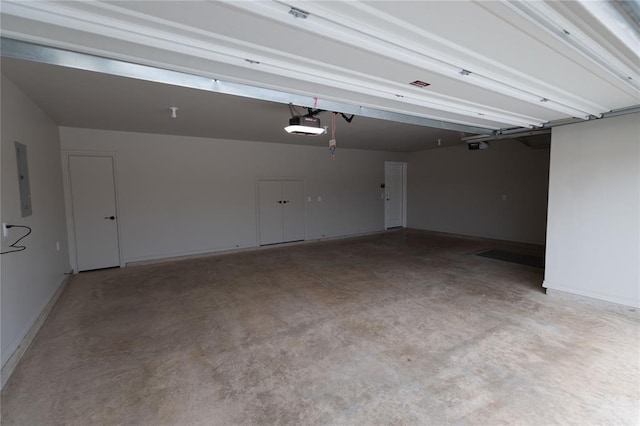 1733 Taines Turn, Norman, OK 73072 - garage with electric panel and a garage door opener