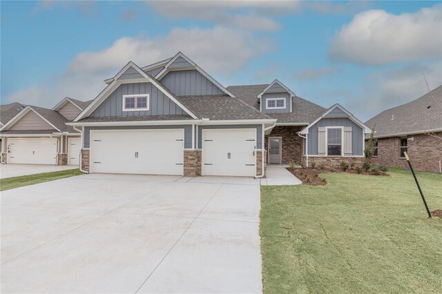 1733 Taines Turn, Norman, OK 73072 - craftsman house with board and batten siding, a shingled roof, concrete driveway, a front yard, and a garage