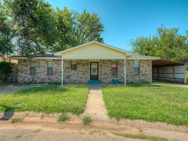 single story home with a front lawn, a porch, and a carport