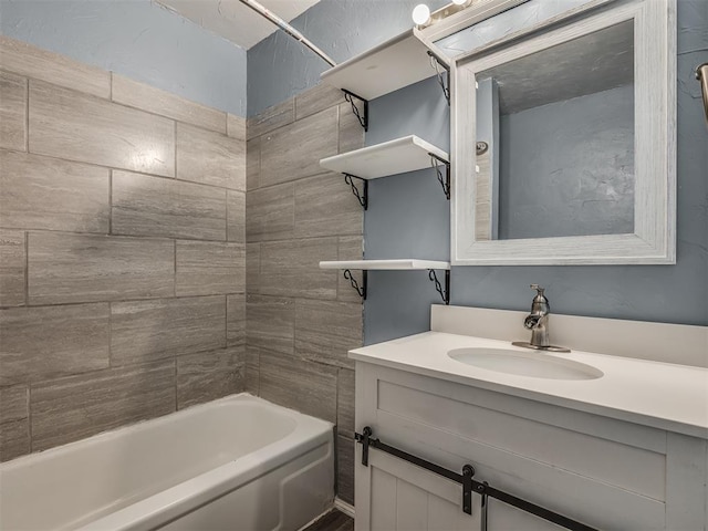 bathroom featuring vanity and tiled shower / bath combo